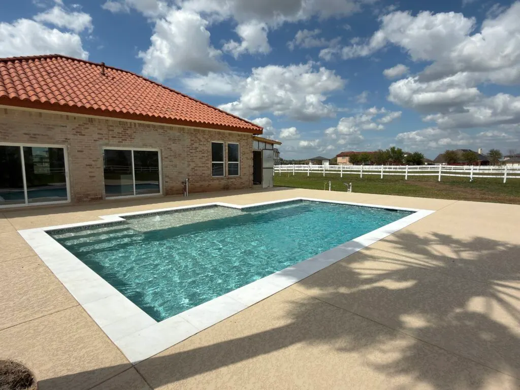 Modern square pool with sun deck built by Mango Pool & Spa in Richmond, TX