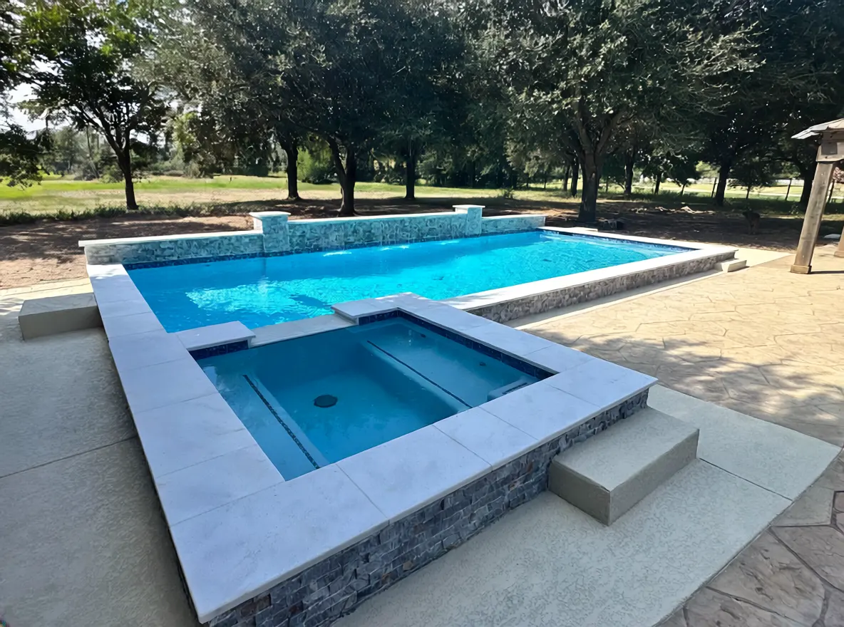Custom pool and spa with natural landscaping in Cypress, TX by Mango Pool & Spa